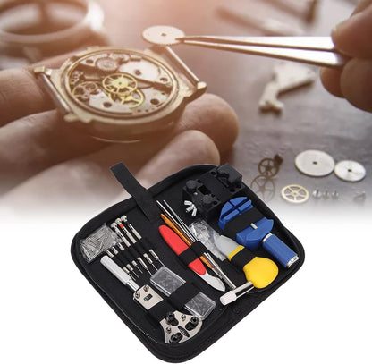 Watch repair tools set with a watch being repaired on a blurred background